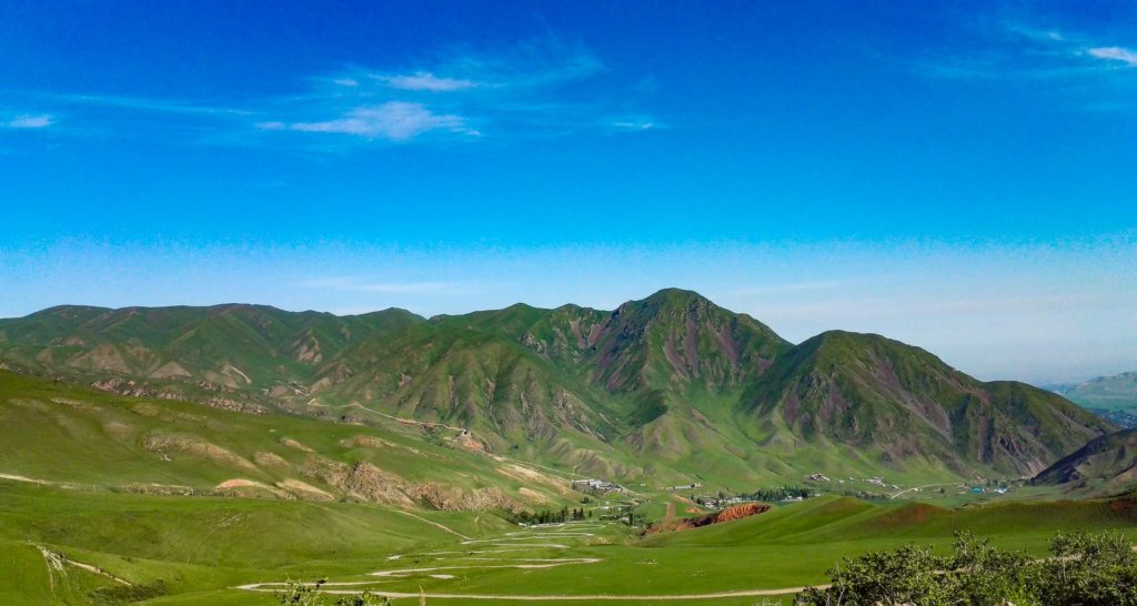 Red cliffs in Chunkurchak gorge in Kyrgyzstan