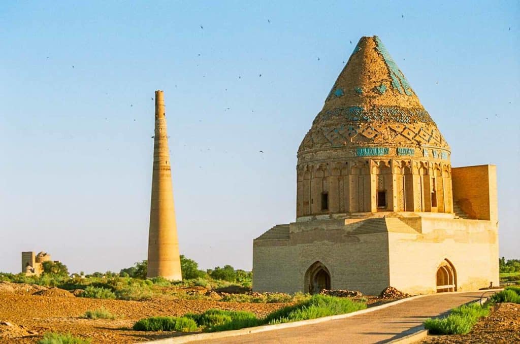 Sultan Tekesh mausoleum with Timur Qutlugh minaret in the background in Konye Urgench