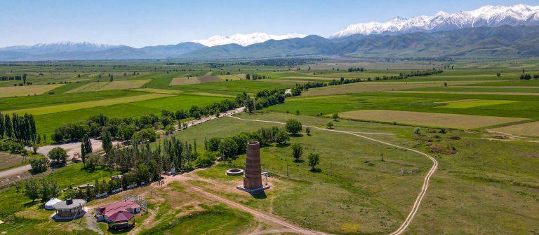 Burana tower with Tien Shan mountains behind, Kyrgyzstan