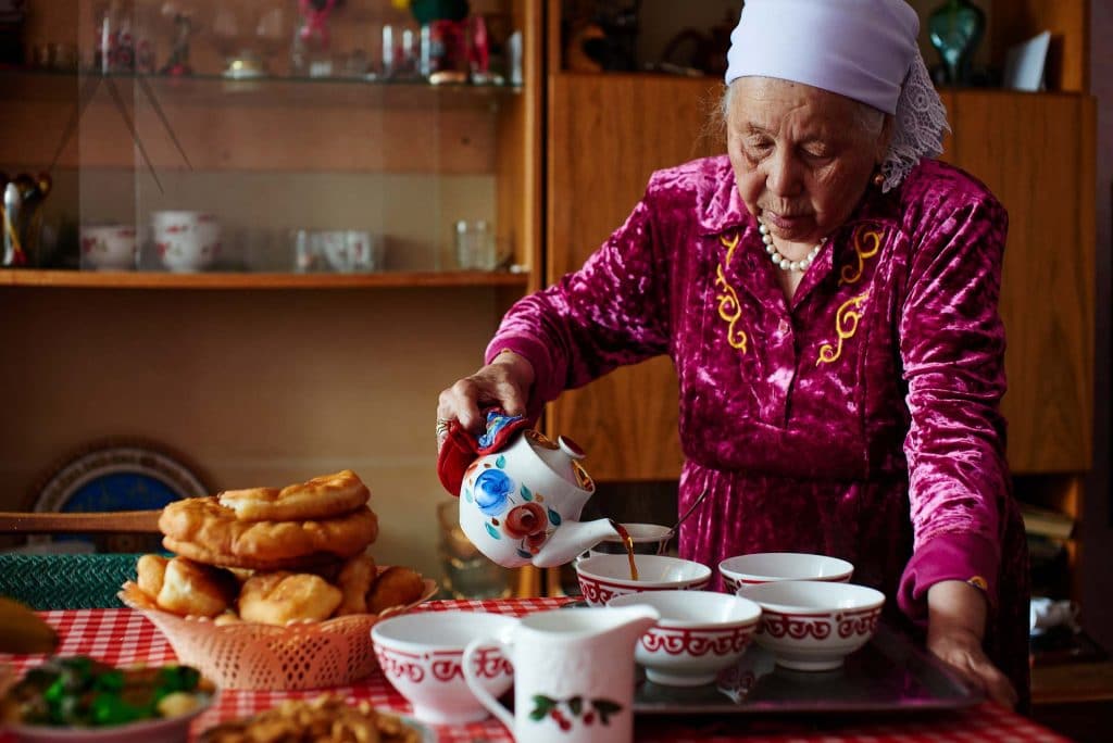 Kazakh grandma pours tea