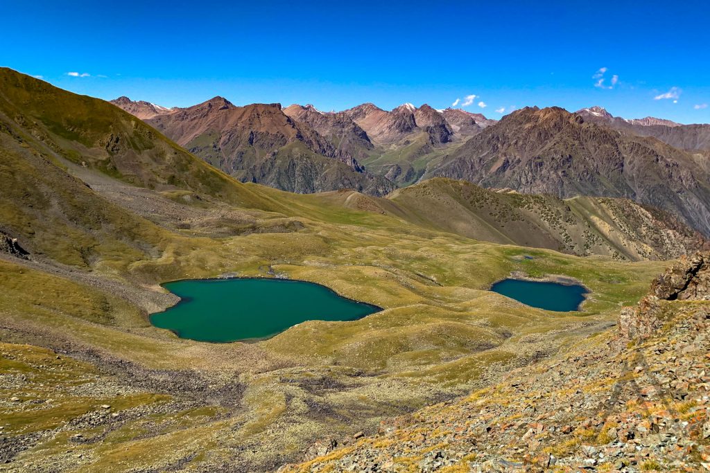 Two small mountain lakes at the Too Ashuu pass on the way to Suusamur