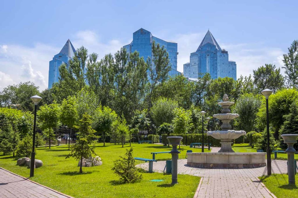 Park of the first president in Almaty with the high rise business buildings in the background