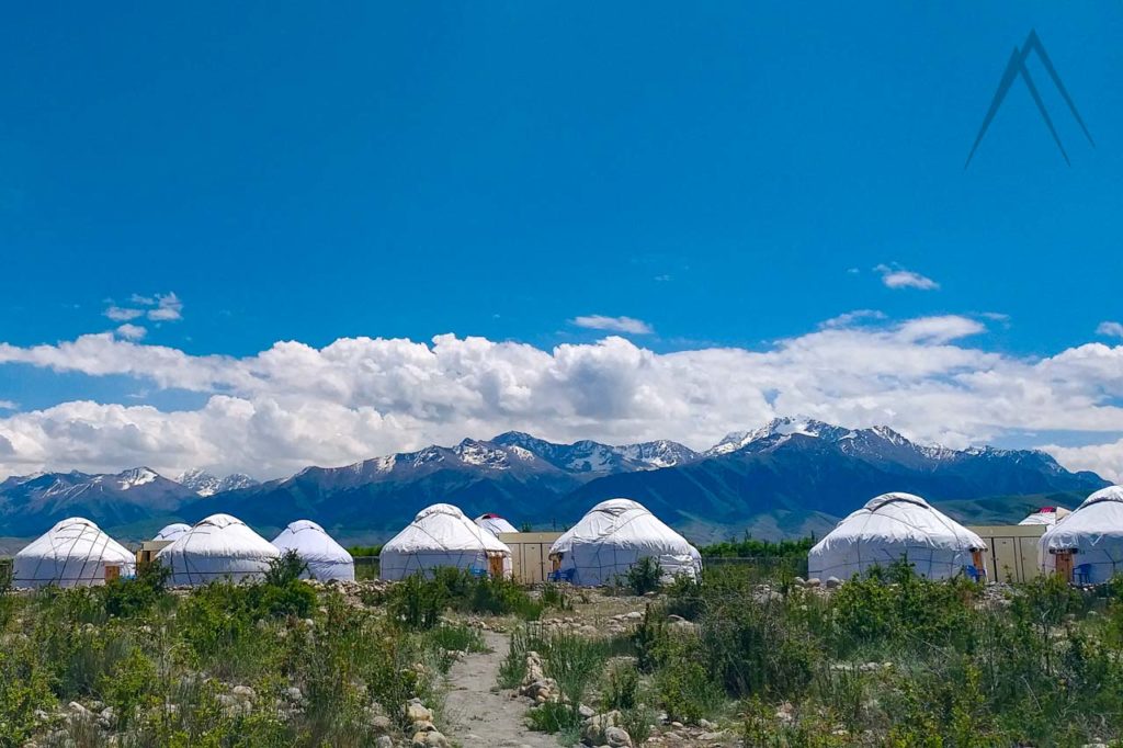 Yurt camp next to mountains