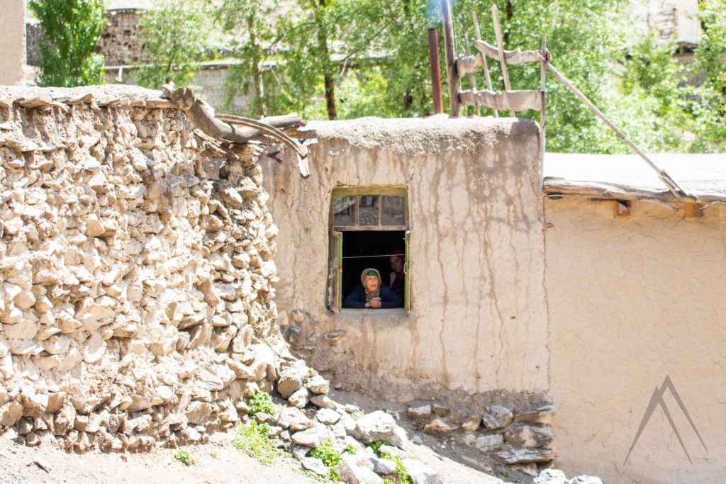 Voru village resident looking from the window