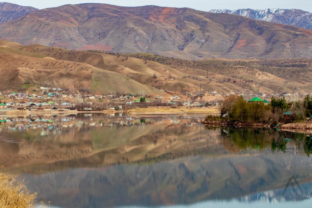Reflection of a Tajiki village on the River Vaksh on the way to Nurek dam