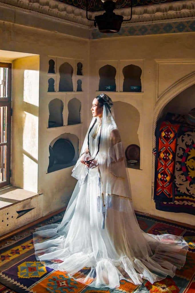 Uzbek woman wearing a white wedding dress