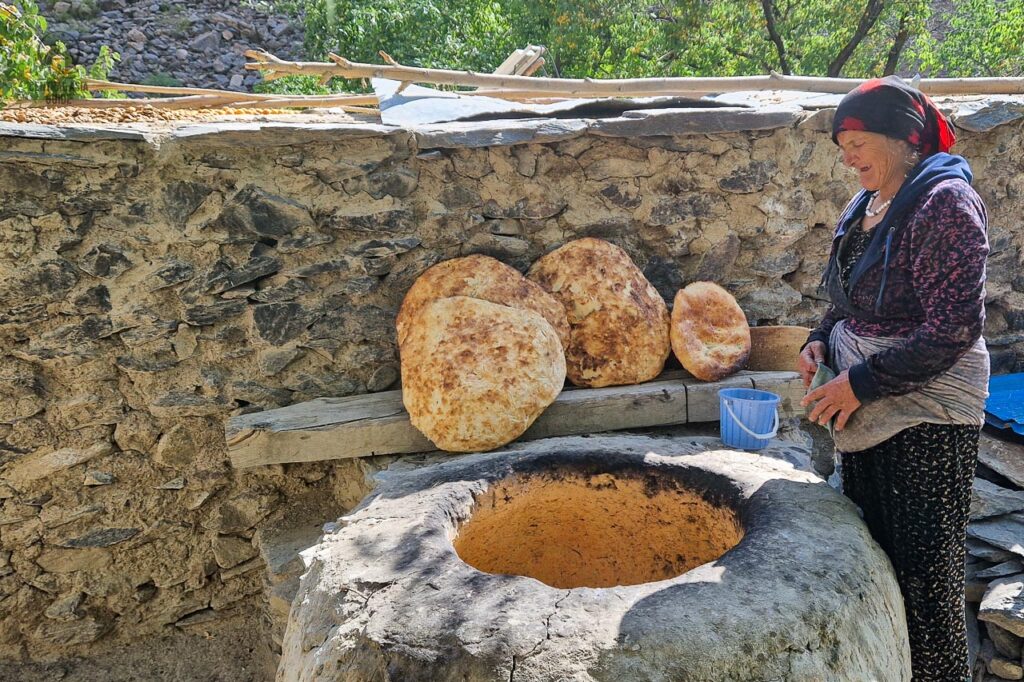 Pamirian bread being prepared in a tandir in Jizev village