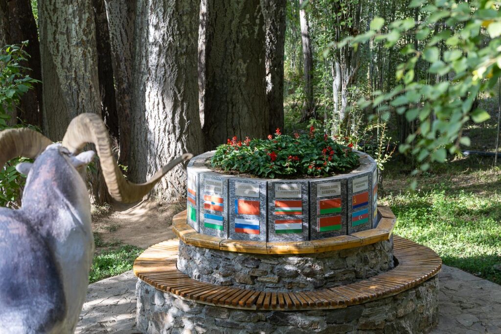 A memorial displaying all the flags of former Soviet states in Khorog botanical garden