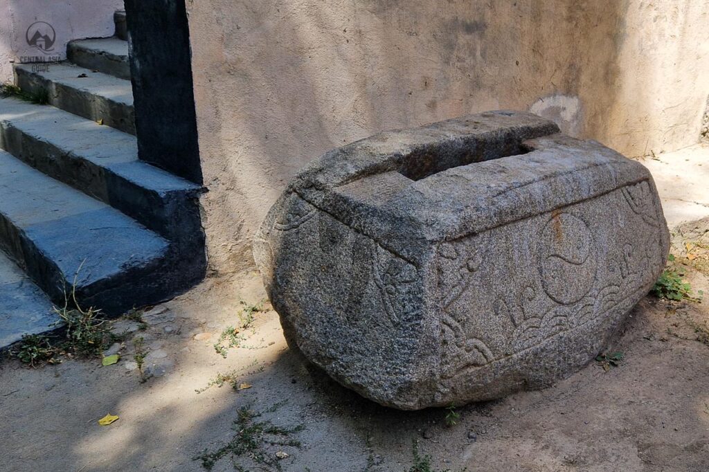 A stone with Chinese markings and ying and yang symbol at the entrance of the Khorog Museum. Allegedly it is a victory sign that was taken here from somewhere else in Pamiri mountains