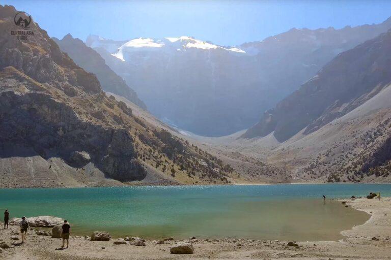 Kulikalon lake in Fann mountains with people swimming