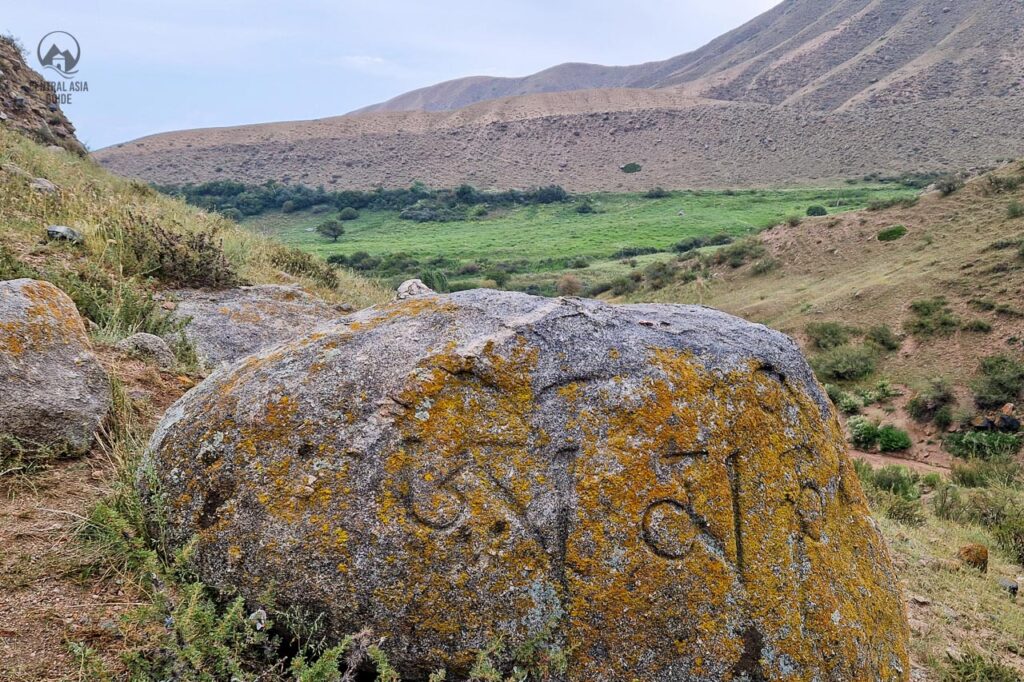 Tamga Tash buddhist stone in Tamga gorge near Issyk Kul