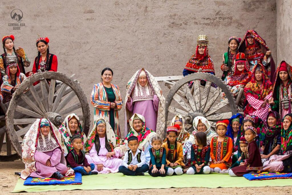 Group of women and children wearing traditional Karakalpak clothes