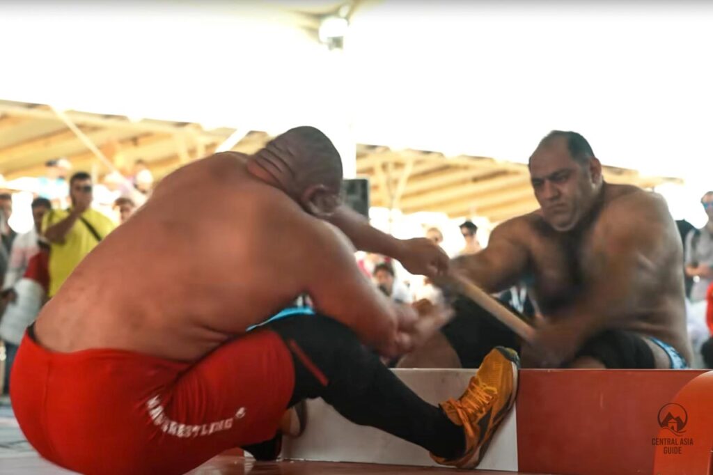 Kazakh national game where men are trying to pull each other over a block