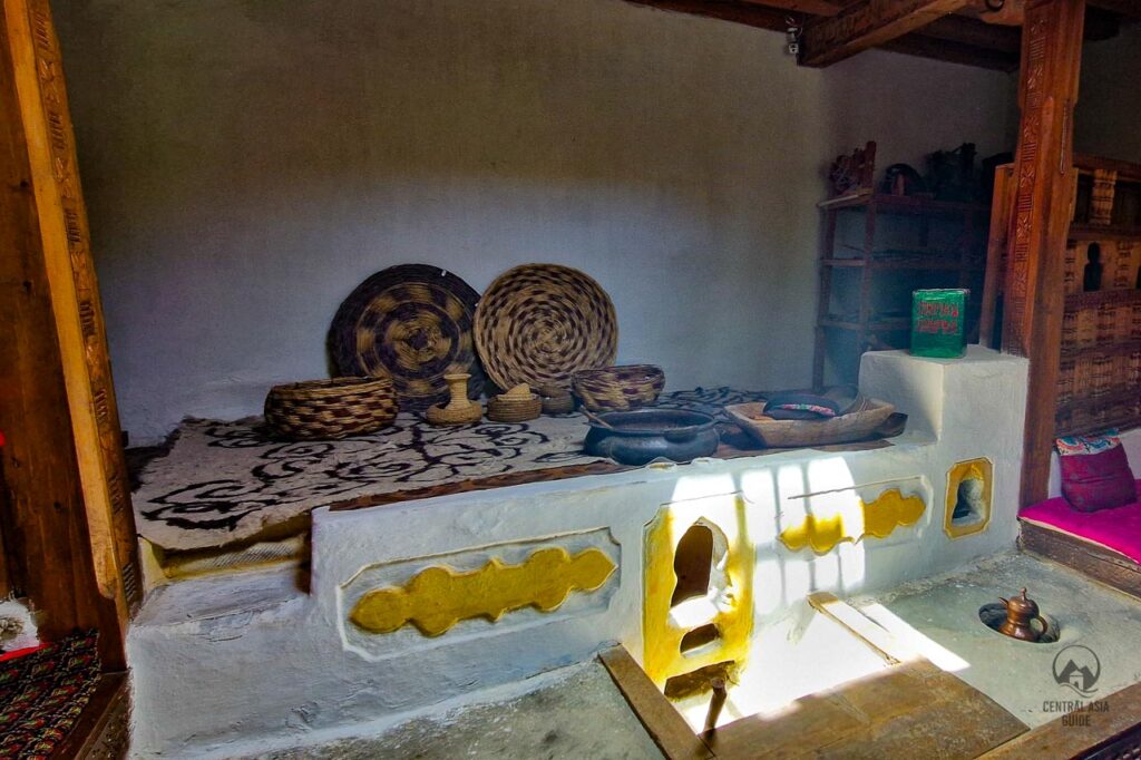 Traditional Pamiri house cooking area with light from the sun roof.