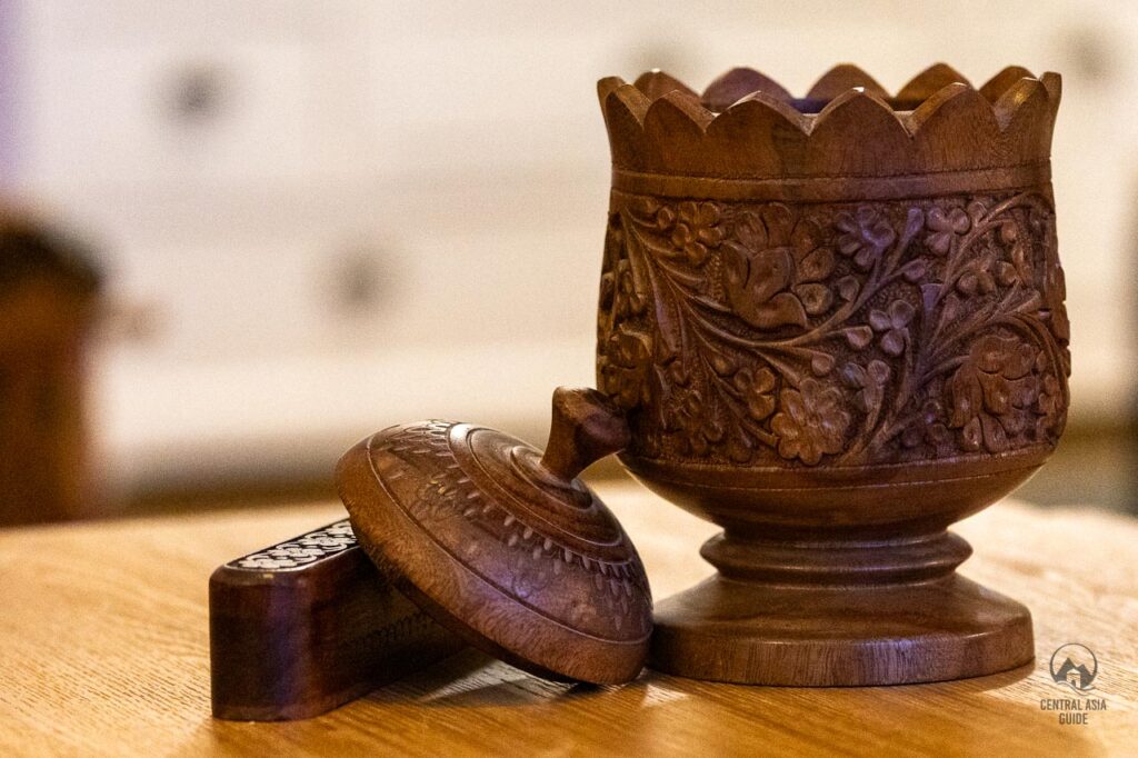 Tajik wood carving craft include honey pots and secret containers